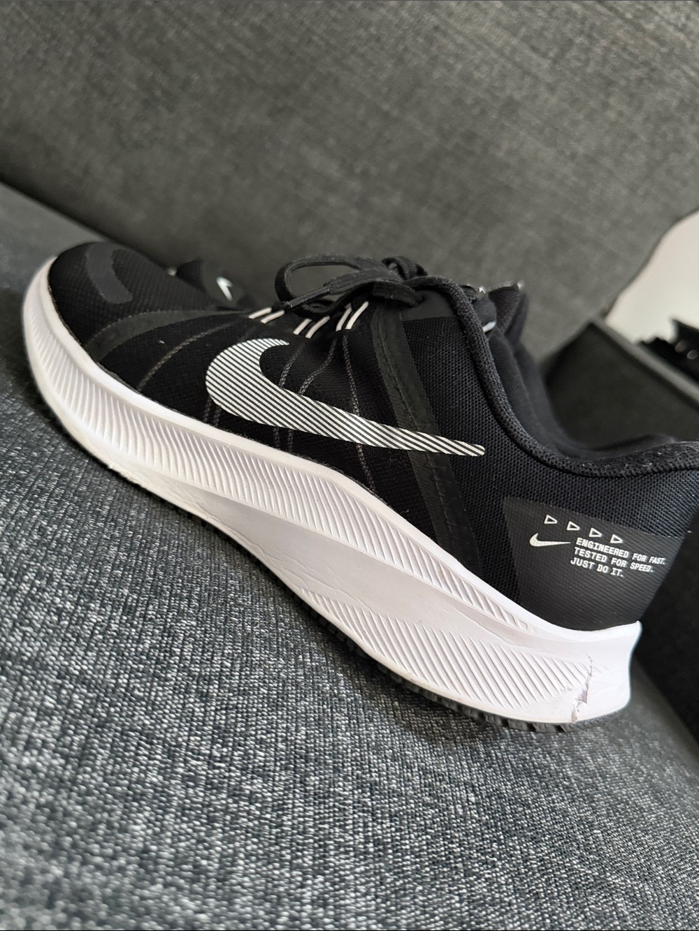 Nike Black and White Running Shoe with Striped Swoosh